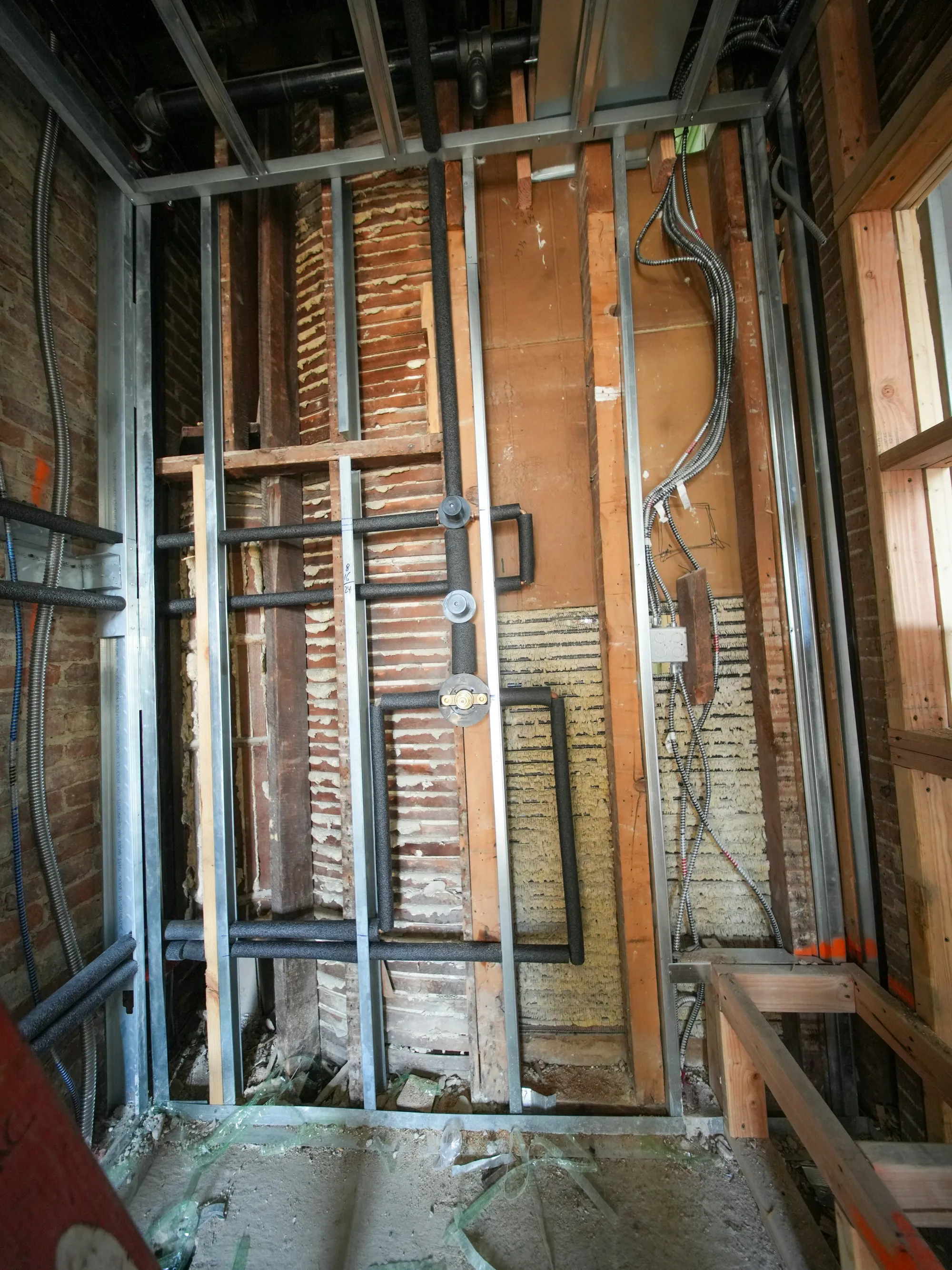 Opened walls and exposed framing in an older building